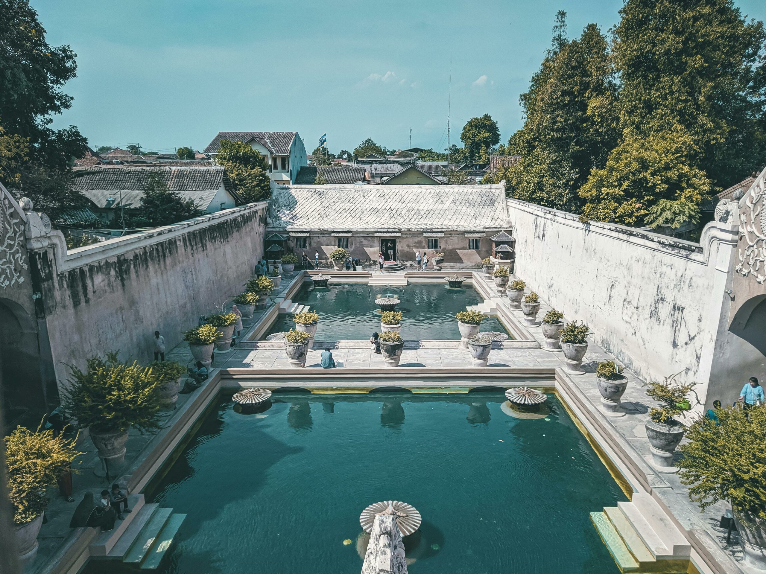 A scenic view of Taman Sari's historic pools and architecture in Yogyakarta, Indonesia.